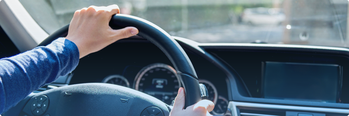 hands on wheel in car