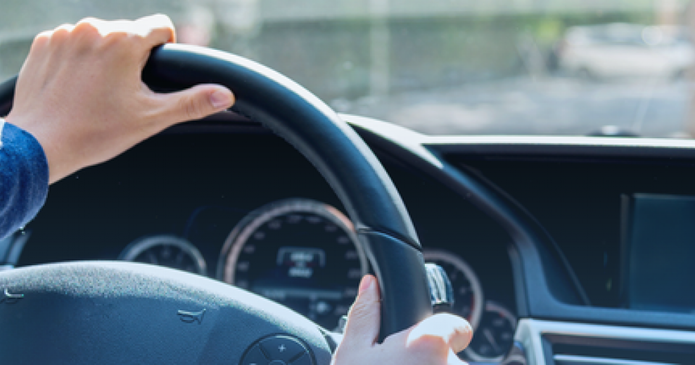 hands on wheel in car